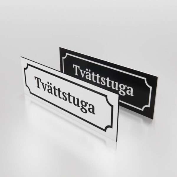 Tvättstuga - Skylt som markerar platsen för en tvättstuga.